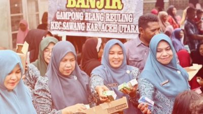 Ringankan Beban Korban Bencana, Ny. Musliana Ismail Dampingi TP-PKK Pusat Salurkan Bantuan di Aceh Utara